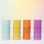 Load image into Gallery viewer, Blue, yellow, orange, and purple colors of Noz’s sunscreen sticks 
