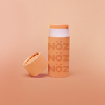 Load image into Gallery viewer, orange Noz vegan, cruelty-free, reef safe sunscreen stick 
